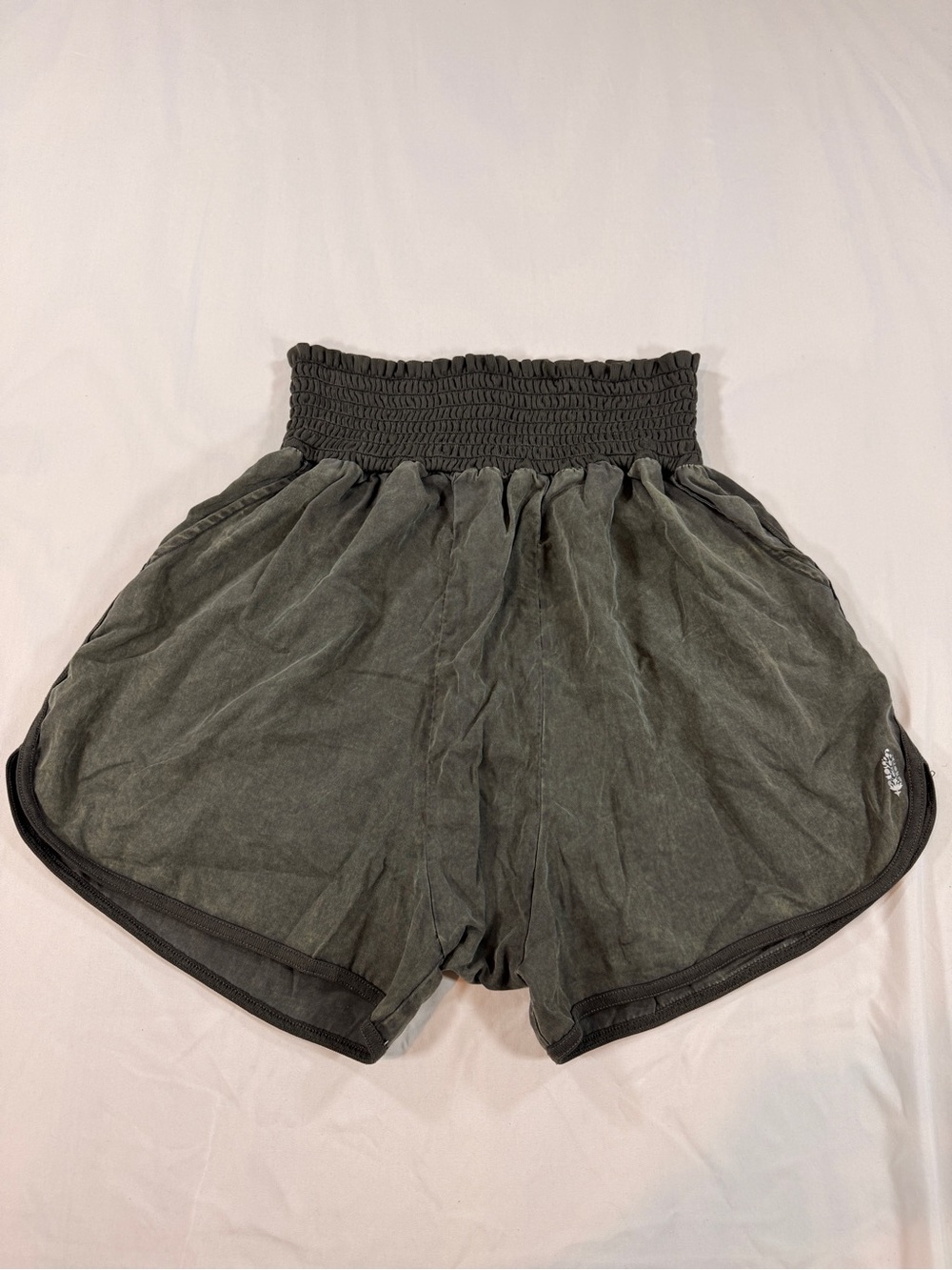 Free People Movement Smocked High-Rise Shorts in Olive Green Wash. Size M